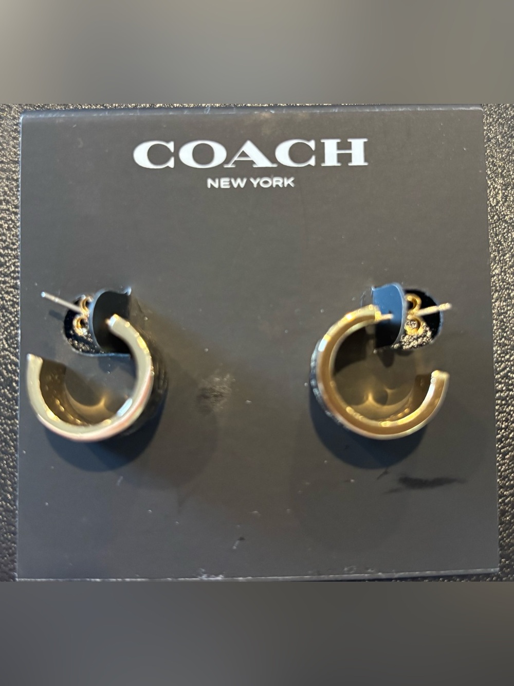 “C” designer earrings in EUC